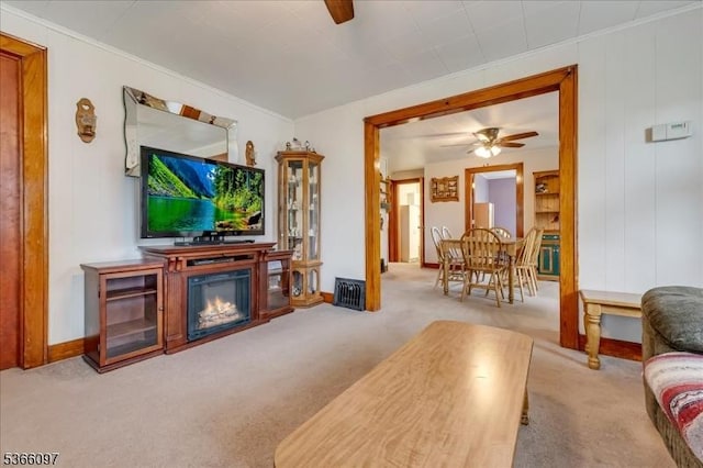 159 Aurora St, Lopatcong Twp, NJ 08865 - living room with a ceiling fan, carpet floors, crown molding, and a glass covered fireplace
