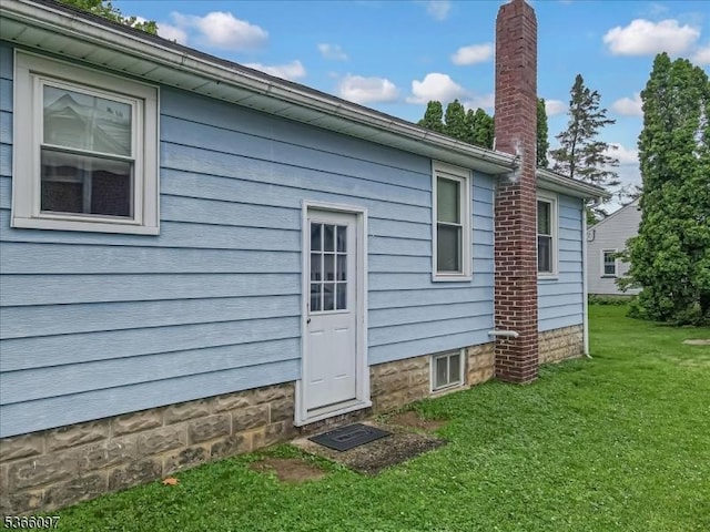 159 Aurora St, Lopatcong Twp, NJ 08865 - rear view of house featuring a lawn and a chimney