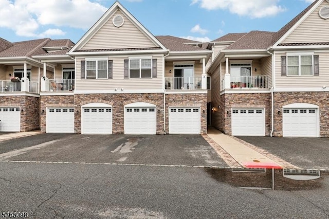 28 Elston Ct Unit 28, Wanaque Boro, NJ 07420 - townhome / multi-family property featuring driveway, stone siding, and an attached garage