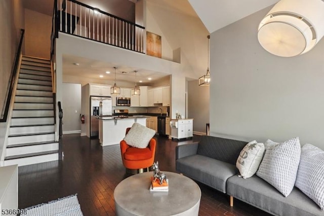 28 Elston Ct Unit 28, Wanaque Boro, NJ 07420 - living room featuring dark wood-style flooring, stairs, and high vaulted ceiling
