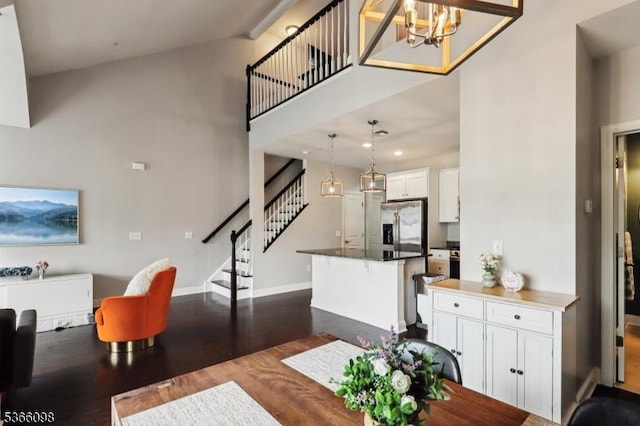 28 Elston Ct Unit 28, Wanaque Boro, NJ 07420 - dining room featuring stairs, dark wood finished floors, a chandelier, a towering ceiling, and recessed lighting