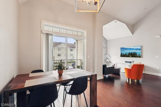 28 Elston Ct Unit 28, Wanaque Boro, NJ 07420 - dining space featuring wood finished floors, high vaulted ceiling, and a chandelier