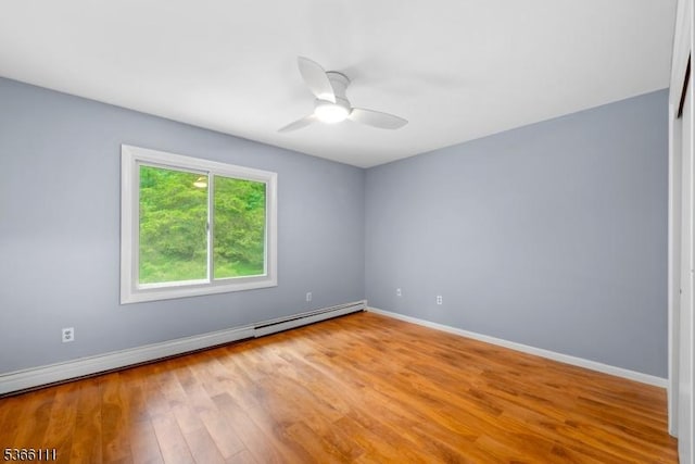 1 Lee Hill Rd, Byram Twp, NJ 07821 - spare room with a baseboard heating unit, wood finished floors, and a ceiling fan