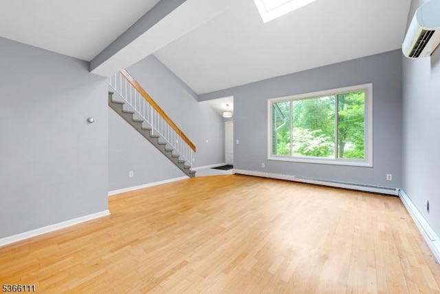 1 Lee Hill Rd, Byram Twp, NJ 07821 - unfurnished living room featuring a baseboard heating unit, a wall unit AC, stairway, light wood-type flooring, and a skylight