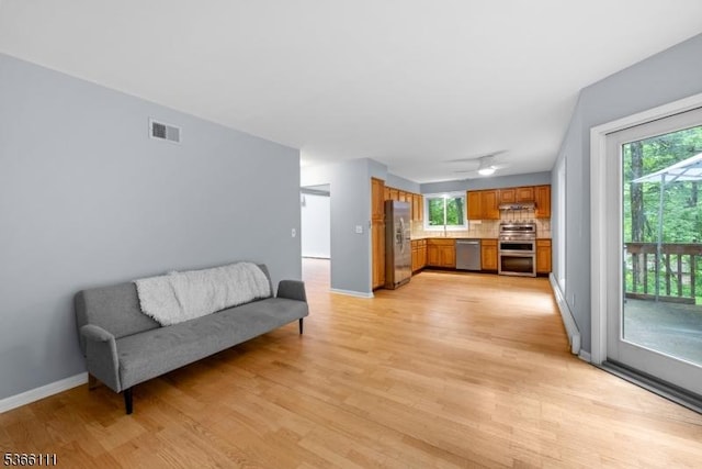1 Lee Hill Rd, Byram Twp, NJ 07821 - living area with light wood-type flooring, plenty of natural light, and ceiling fan