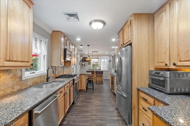 19 Elm St, Wanaque Boro, NJ 07420 - kitchen featuring stainless steel appliances, dark wood-style floors, dark stone counters, backsplash, and recessed lighting