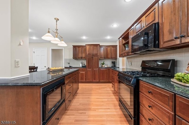 10 Cedarview Ct, Hillsborough Twp, NJ 08844 - kitchen featuring black appliances, light wood-style floors, decorative backsplash, dark stone countertops, and hanging light fixtures
