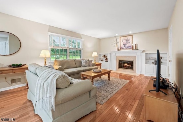 10 Cedarview Ct, Hillsborough Twp, NJ 08844 - living room with a premium fireplace, light wood-style flooring, and recessed lighting