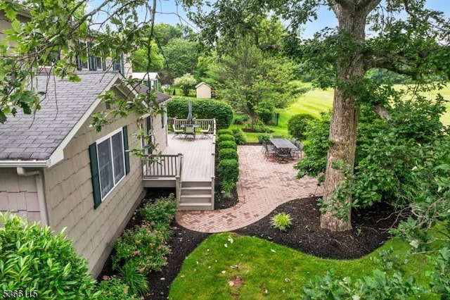 10 Cedarview Ct, Hillsborough Twp, NJ 08844 - view of yard with outdoor dining area, a deck, and view of wooded area