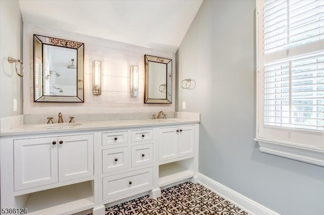 109 Chatham St, Chatham Boro, NJ 07928 - bathroom with double vanity, healthy amount of natural light, lofted ceiling, and tile patterned floors