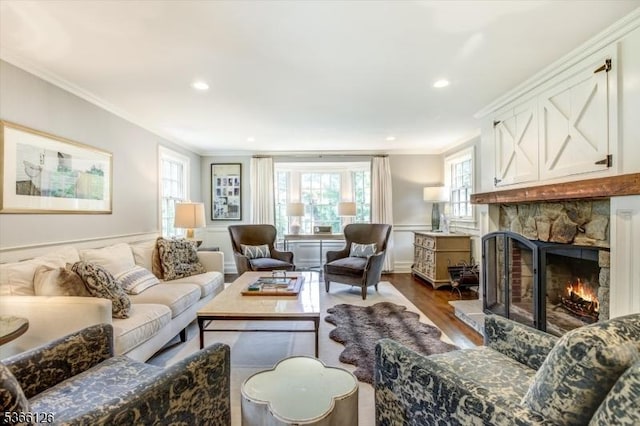 109 Chatham St, Chatham Boro, NJ 07928 - living room featuring healthy amount of natural light, dark wood-style floors, crown molding, a stone fireplace, and recessed lighting