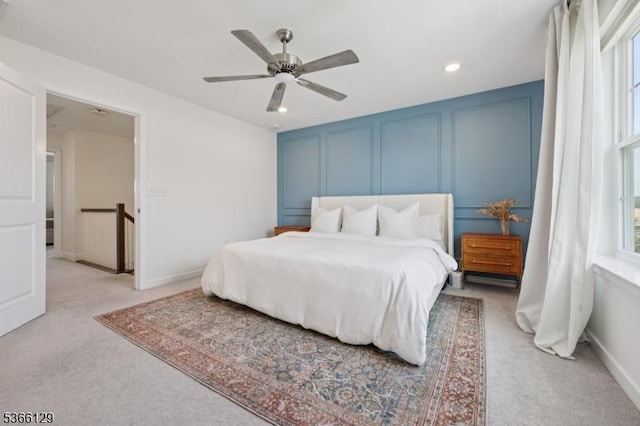 12 Colgate Dr, Morris Twp, NJ 07960 - bedroom featuring light colored carpet, a decorative wall, multiple windows, a ceiling fan, and recessed lighting