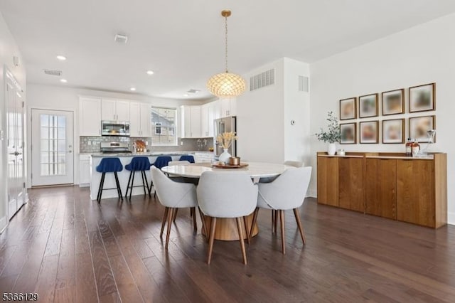 12 Colgate Dr, Morris Twp, NJ 07960 - dining area with dark wood finished floors and recessed lighting