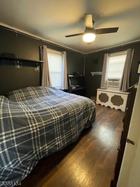 136 N 21st St, Kenilworth Boro, NJ 07033 - bedroom featuring wood finished floors, cooling unit, and a ceiling fan