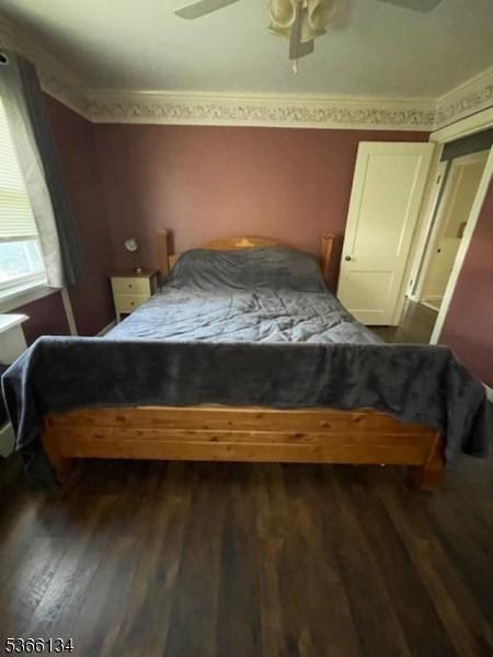 136 N 21st St, Kenilworth Boro, NJ 07033 - bedroom with dark wood finished floors and ceiling fan