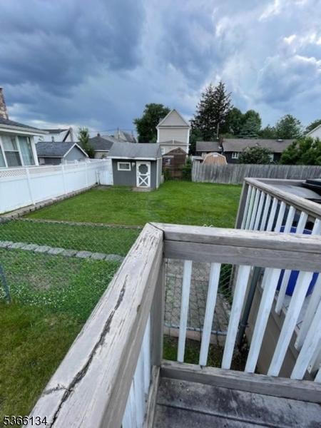 136 N 21st St, Kenilworth Boro, NJ 07033 - fenced backyard featuring a storage unit