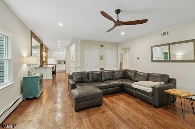 4 Knollwood Ln, Hardyston Twp, NJ 07460 - living area featuring baseboard heating, ceiling fan, wood finished floors, and recessed lighting