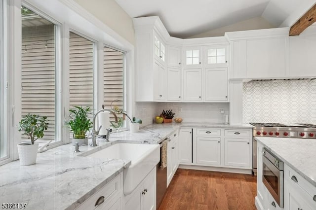 4 Knollwood Ln, Hardyston Twp, NJ 07460 - kitchen featuring stainless steel appliances, white cabinets, wood finished floors, light stone counters, and lofted ceiling