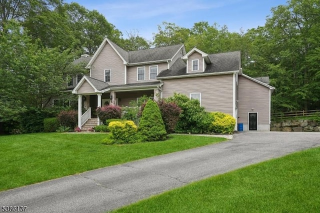 4 Knollwood Ln, Hardyston Twp, NJ 07460 - view of front of property featuring a front lawn, a porch, and driveway