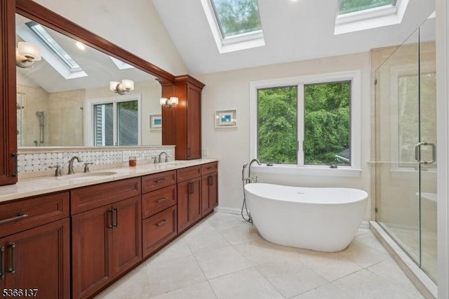 4 Knollwood Ln, Hardyston Twp, NJ 07460 - full bathroom featuring a skylight, vaulted ceiling, double vanity, a stall shower, and a freestanding bath