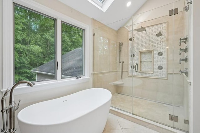 4 Knollwood Ln, Hardyston Twp, NJ 07460 - bathroom featuring a soaking tub, a stall shower, tile patterned floors, vaulted ceiling, and a skylight