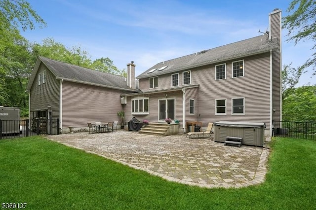 4 Knollwood Ln, Hardyston Twp, NJ 07460 - back of property featuring a chimney, a hot tub, and a patio
