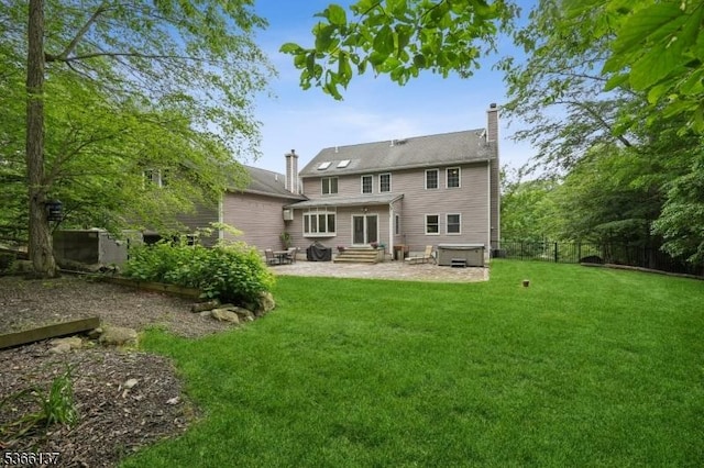 4 Knollwood Ln, Hardyston Twp, NJ 07460 - rear view of house with entry steps, a patio area, and a chimney
