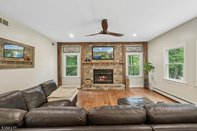 4 Knollwood Ln, Hardyston Twp, NJ 07460 - living area with a baseboard heating unit, wood finished floors, a ceiling fan, a fireplace, and recessed lighting