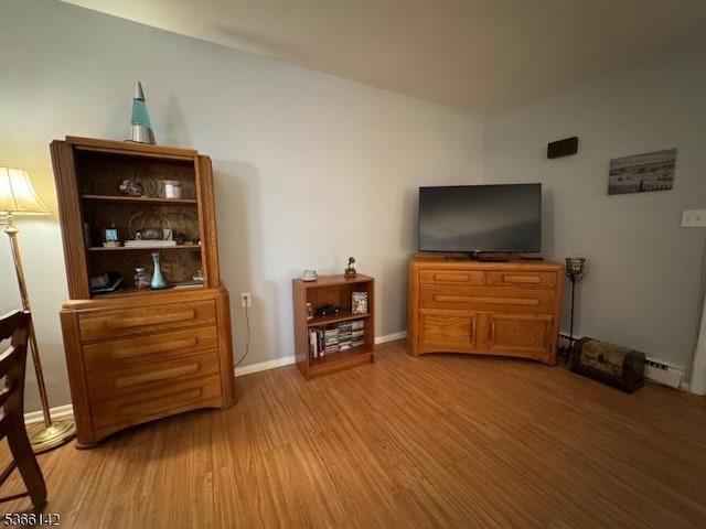 472B Thornbury Ct, Lakewood Twp, NJ 08701 - living room with light wood-style flooring and baseboard heating
