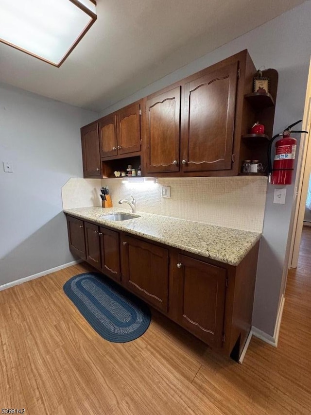 472B Thornbury Ct, Lakewood Twp, NJ 08701 - kitchen with open shelves, backsplash, and light wood-type flooring