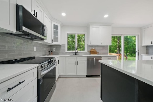 463 Garretson Rd, Bridgewater Twp, NJ 08807 - kitchen with appliances with stainless steel finishes, light countertops, backsplash, white cabinets, and recessed lighting