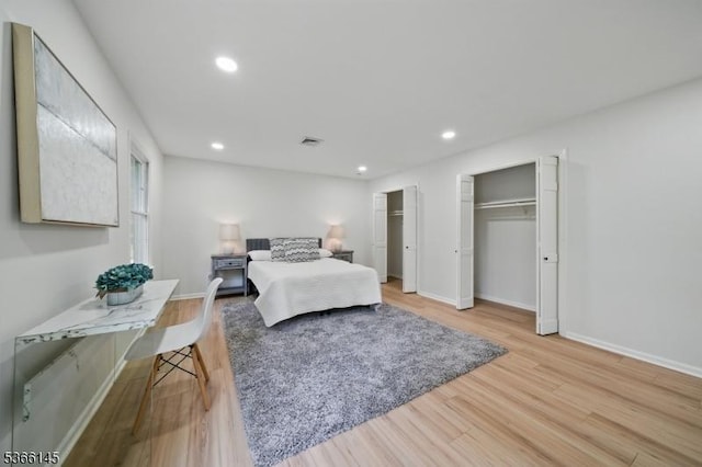 463 Garretson Rd, Bridgewater Twp, NJ 08807 - bedroom with multiple closets, wood finished floors, and recessed lighting