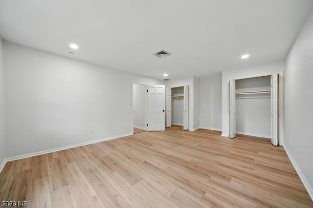 463 Garretson Rd, Bridgewater Twp, NJ 08807 - unfurnished bedroom with light wood-style flooring, multiple closets, and recessed lighting