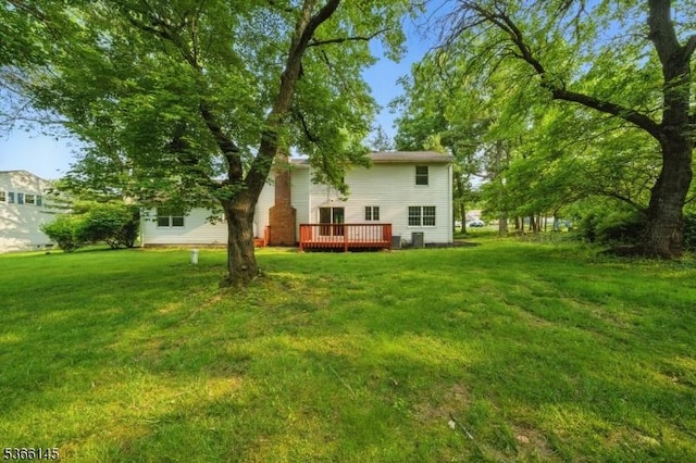 463 Garretson Rd, Bridgewater Twp, NJ 08807 - view of green lawn featuring a deck