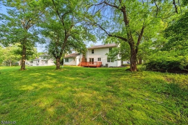463 Garretson Rd, Bridgewater Twp, NJ 08807 - view of grassy yard featuring a deck