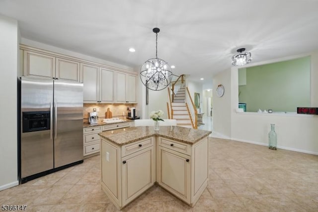 43 Saunders Ln, Mount Olive Twp, NJ 07840 - kitchen with cream cabinets, stainless steel refrigerator with ice dispenser, a chandelier, tasteful backsplash, and a kitchen island