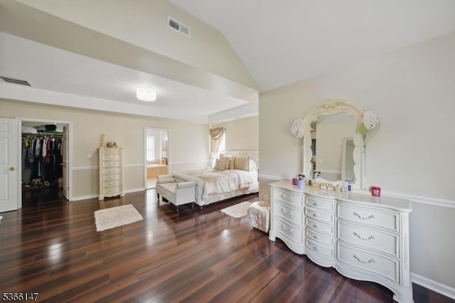 43 Saunders Ln, Mount Olive Twp, NJ 07840 - bedroom featuring wood finished floors, vaulted ceiling, a walk in closet, and ensuite bathroom
