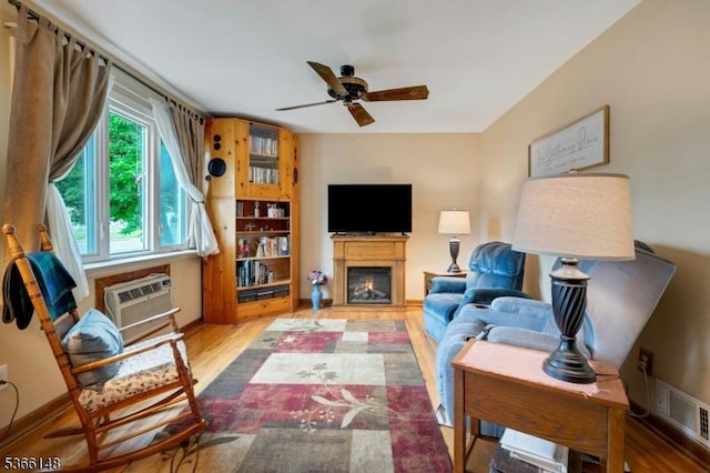 26 Mitchell St, Belleville Twp, NJ 07109 - living room with ceiling fan, a lit fireplace, wood finished floors, and a wall mounted air conditioner