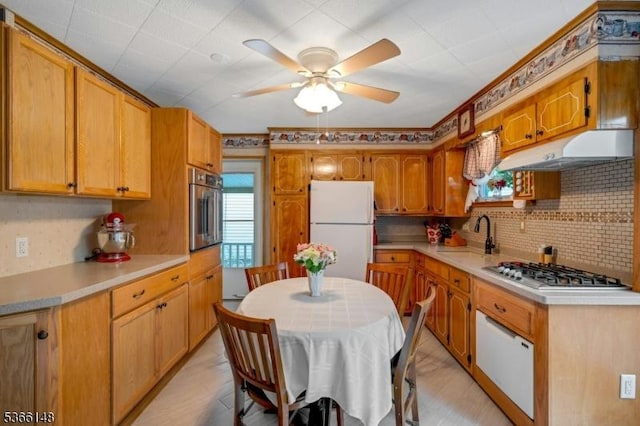 26 Mitchell St, Belleville Twp, NJ 07109 - kitchen with stainless steel appliances, under cabinet range hood, ceiling fan, decorative backsplash, and light countertops