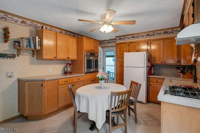 26 Mitchell St, Belleville Twp, NJ 07109 - kitchen featuring appliances with stainless steel finishes, ceiling fan, light countertops, extractor fan, and brown cabinets
