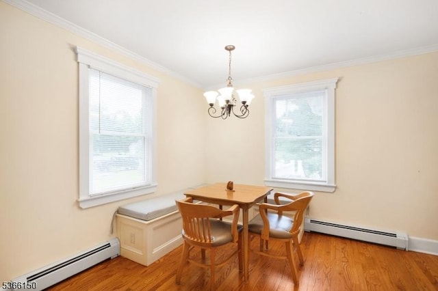 52 E Ave, Washington Twp, NJ 07840 - dining room featuring a baseboard radiator, a chandelier, ornamental molding, and light wood-style flooring