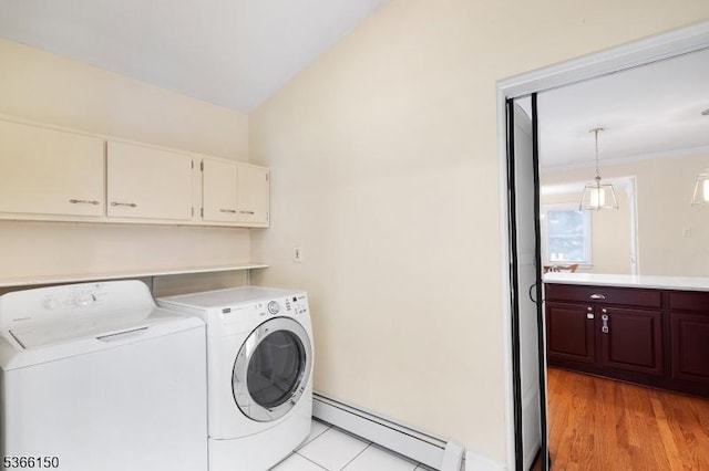 52 E Ave, Washington Twp, NJ 07840 - washroom featuring baseboard heating, washer and dryer, cabinet space, and light wood-style flooring