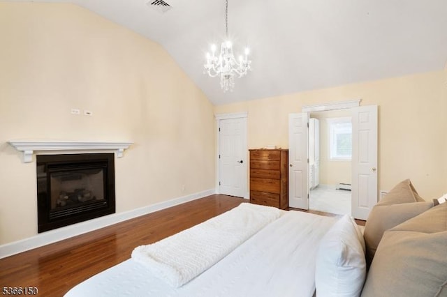 52 E Ave, Washington Twp, NJ 07840 - bedroom featuring lofted ceiling, wood finished floors, a chandelier, and a glass covered fireplace