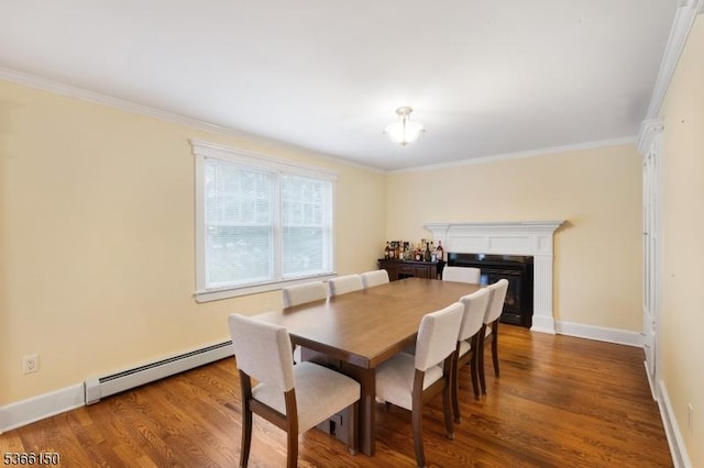 52 E Ave, Washington Twp, NJ 07840 - dining area with baseboard heating, wood finished floors, ornamental molding, and a glass covered fireplace