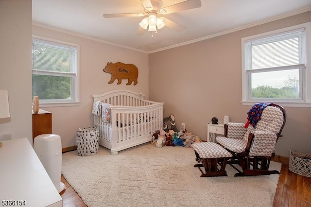105 Rolling Acres Dr, Hampton Twp, NJ 07860 - bedroom featuring wood finished floors, ornamental molding, a crib, and ceiling fan