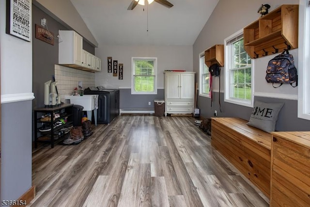 105 Rolling Acres Dr, Hampton Twp, NJ 07860 - kitchen with lofted ceiling, a baseboard radiator, wood finished floors, ceiling fan, and white cabinets