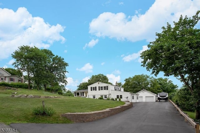 105 Rolling Acres Dr, Hampton Twp, NJ 07860 - view of front of house with an outbuilding, a front yard, driveway, a chimney, and a detached garage