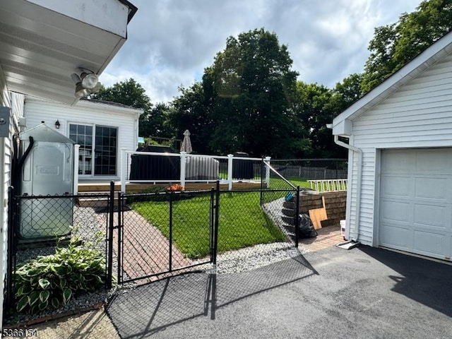 105 Rolling Acres Dr, Hampton Twp, NJ 07860 - fenced yard with a gate, a garage, and driveway