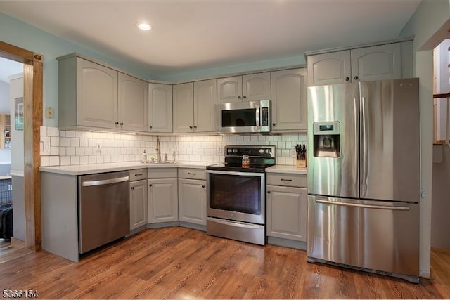 105 Rolling Acres Dr, Hampton Twp, NJ 07860 - kitchen with appliances with stainless steel finishes, light countertops, tasteful backsplash, and recessed lighting