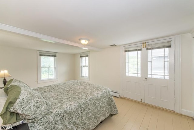 6 Mc Clintock Pl, Parsippany-Troy Hills Twp, NJ 07878 - bedroom featuring baseboard heating, light wood-style floors, and french doors